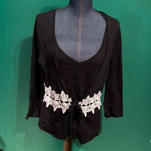 Black sweater with tank top attached. Beautiful lace accent